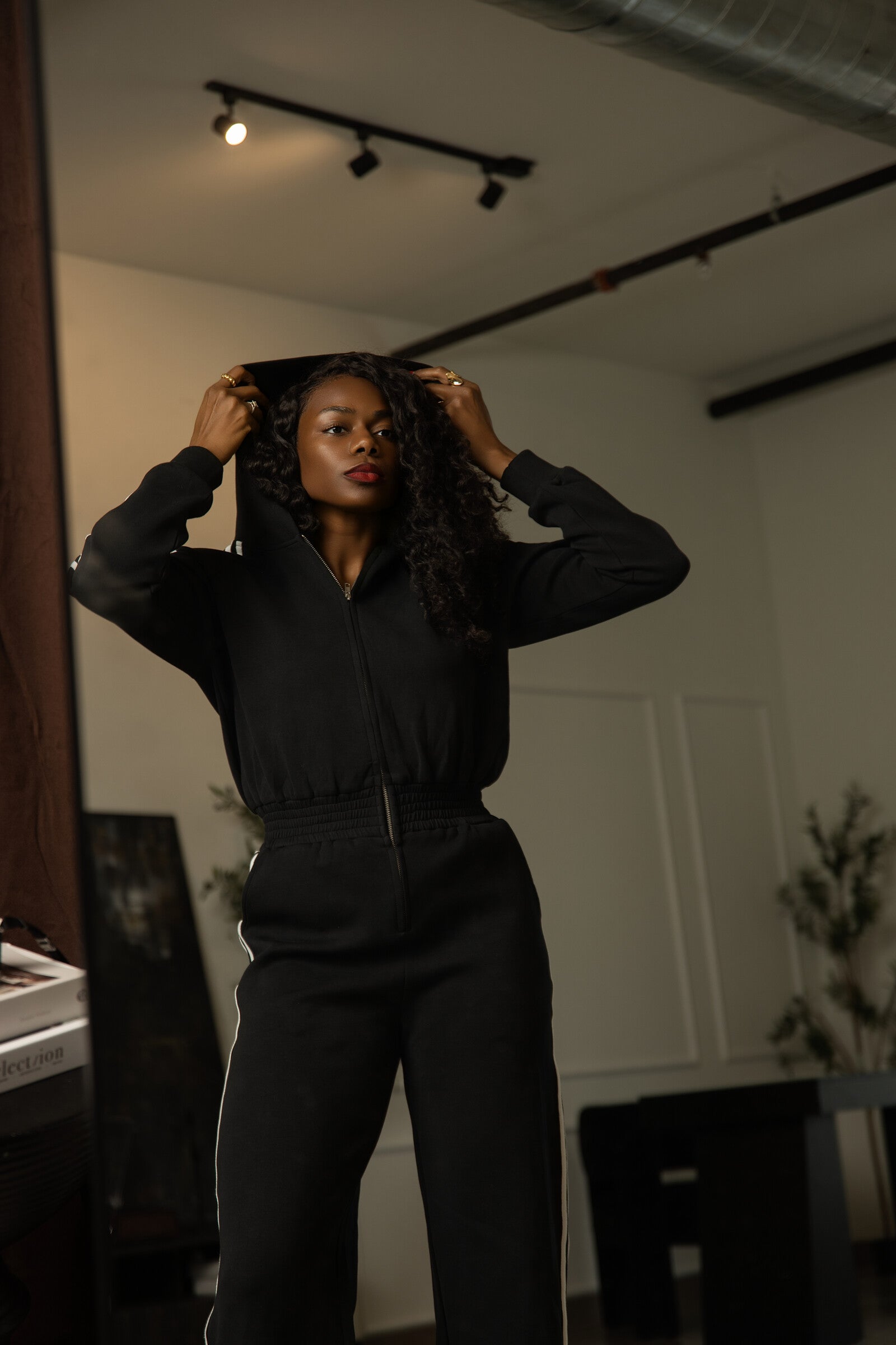 Tall black track jumpsuit hood detail